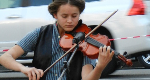 Участница акции протеста "За честные выборы". Волгоград, 13 сентября 2013 г. Фото Татьяны Филимоновой для "Кавказского узла"