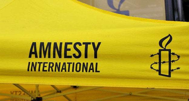 Логотип правозащитной организации Amnesty International. Фото пользователя Metropolico.org flickr.com 