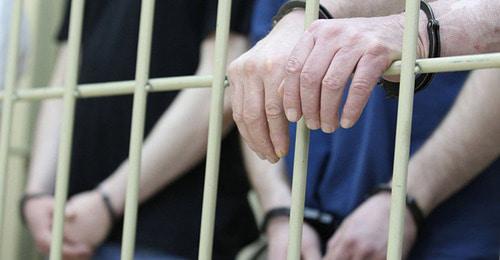Задержанные за решеткой. Фото © Sputnik/ Евгений Биятов

