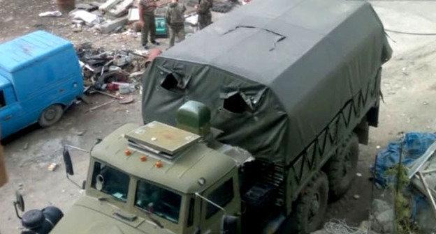 На месте проведения спецоперации в поселке Временный. Унцукульский район Дагестана, сентябрь 2014 г. Кадр из видео "Кавказского узла"